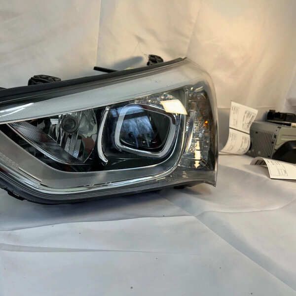 Used 2014 Hyundai Santa Fe LH Headlight Assembly at BackToRoad Auto Parts